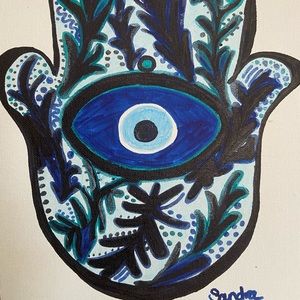 Modern hamsa blue, turquoise and black painting on flat canvas.